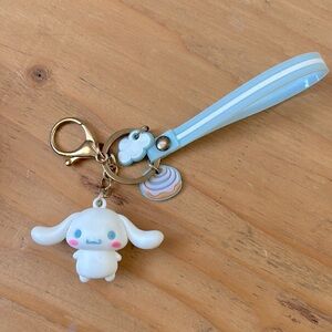 A cinnamoroll keychain and lemon scrunchie